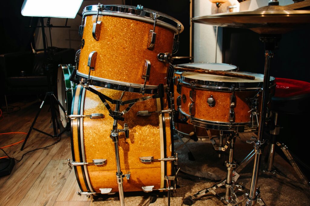 A vibrant drum set in a cozy studio, showcasing the sparkle finish of the drums.